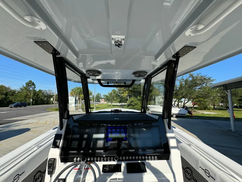 Slide: The Image of 2025 Fountain 38TE boat cockpit with advanced navigation system and sleek design. - 30