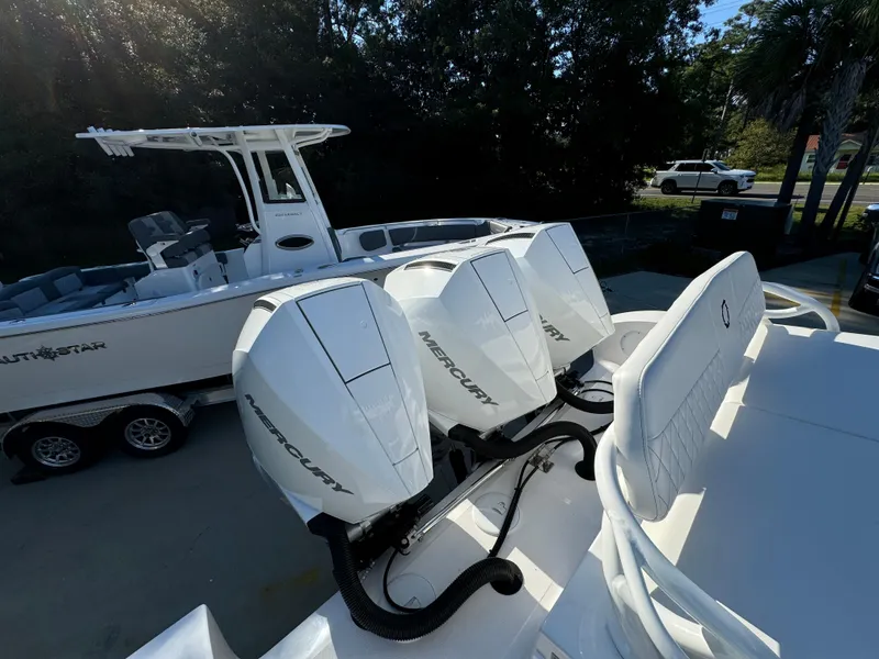 Slide: The Image of 2025 Fountain 38TE boat with triple Mercury outboard engines, parked on a trailer. - 37