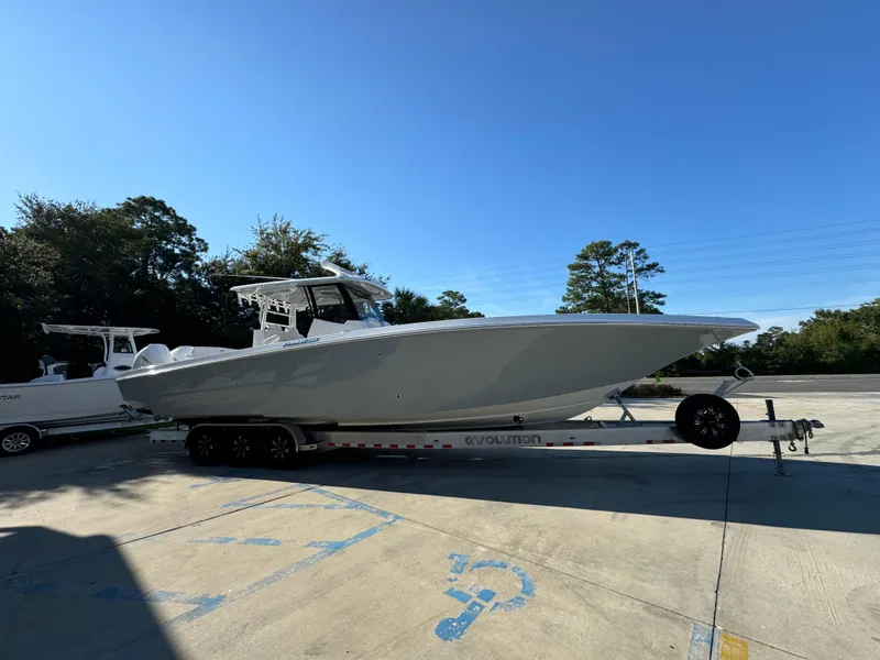 Slide: The Image of 2025 Fountain 38TE boat on trailer in sunny outdoor setting. - 9