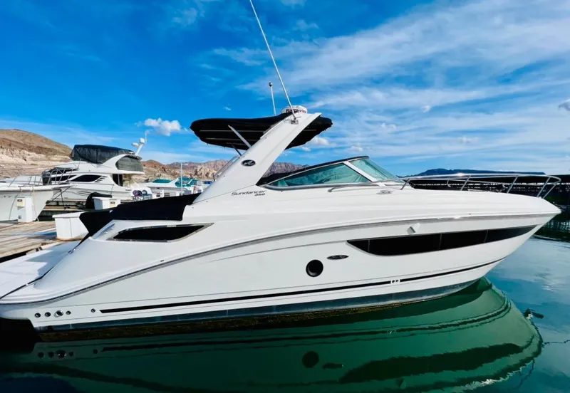 Slide: The Image of 2016 Sea Ray 350 Sundancer yacht docked on a sunny day. - 1