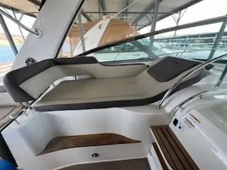 Slide: The Image of 2016 Sea Ray 350 Sundancer interior seating area with modern design and comfortable cushions. - 16
