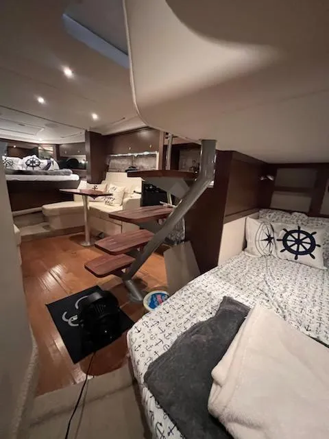 Slide: The Image of Interior of 2016 Sea Ray 350 Sundancer yacht with cozy seating and nautical decor. - 25