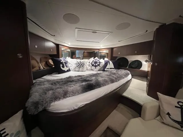 Slide: The Image of Luxurious interior of 2016 Sea Ray 350 Sundancer yacht with cozy bedding. - 28