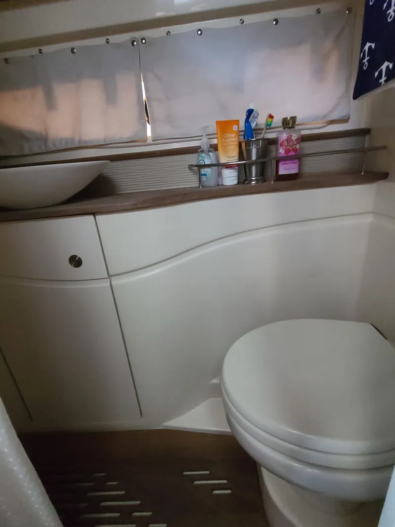 Slide: The Image of Bathroom interior of 2016 Sea Ray 350 Sundancer yacht with modern fixtures. - 30