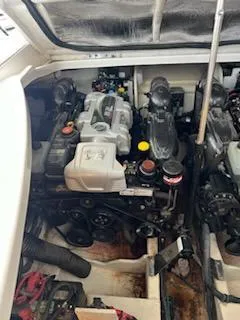 Slide: The Image of Engine compartment of 2016 Sea Ray 350 Sundancer boat, showcasing dual engines. - 32