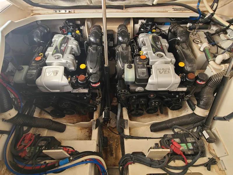 Slide: The Image of 2016 Sea Ray 350 Sundancer engine compartment with dual V8 engines. - 33