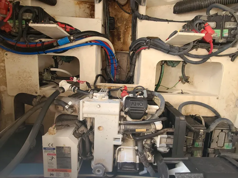 Slide: The Image of Engine compartment of a 2016 Sea Ray 350 Sundancer with visible wiring and components. - 37