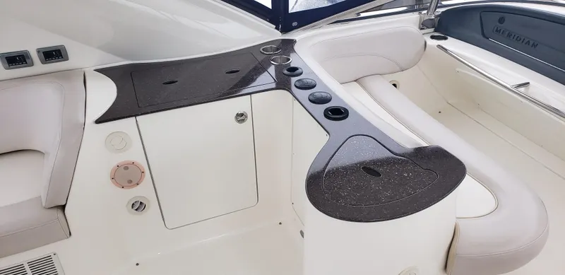 Slide: The Image of 2010 Meridian 441 Sedan yacht interior with sleek seating and modern design. - 11