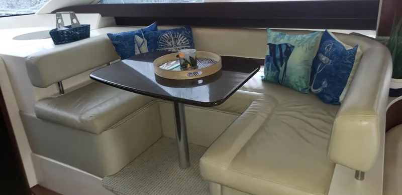 Slide: The Image of Luxurious interior of 2010 Meridian 441 Sedan yacht with cozy seating and decorative pillows. - 16