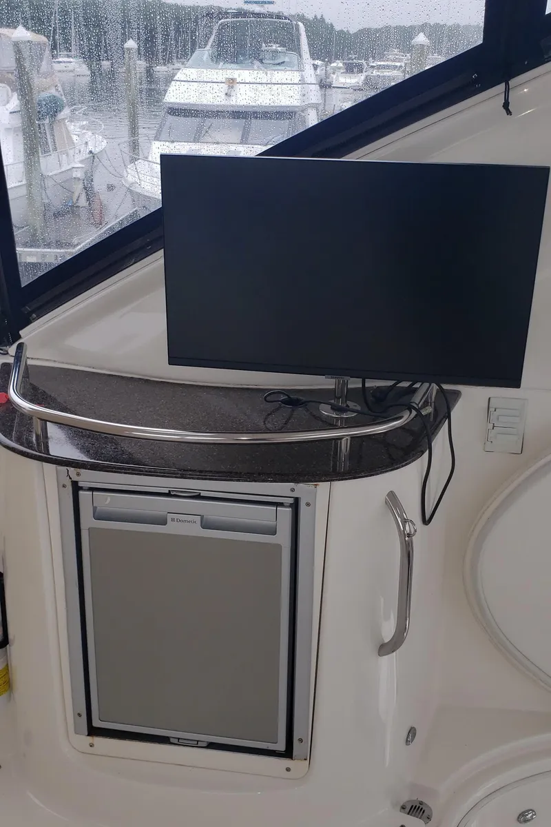 Slide: The Image of 2010 Meridian 441 Sedan interior with TV and mini-fridge. - 21