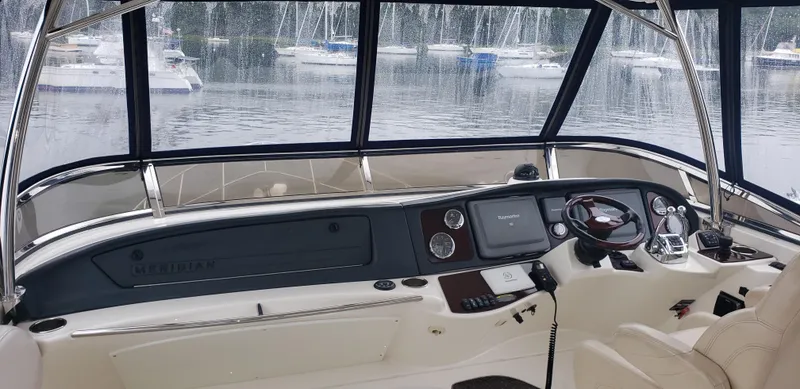 Slide: The Image of Interior view of 2010 Meridian 441 Sedan yacht cockpit with navigation controls. - 8