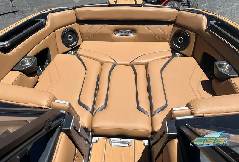 Slide: The Image of 2024 Supra SE boat interior with tan leather seating and integrated speakers. - 19