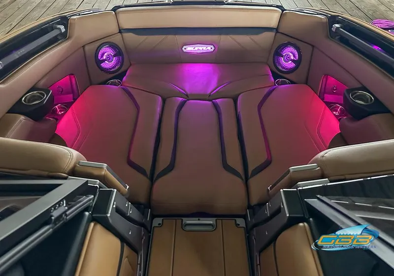 Slide: The Image of 2024 Supra SE boat interior with ambient pink lighting and premium seating. - 27