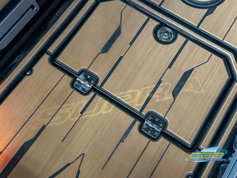Slide: The Image of 2024 Supra SE boat deck with sleek wood finish and black accents. - 34