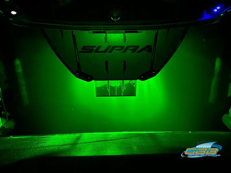 Slide: The Image of 2024 Supra SE with green underglow lighting, showcasing sleek design and modern aesthetics. - 43