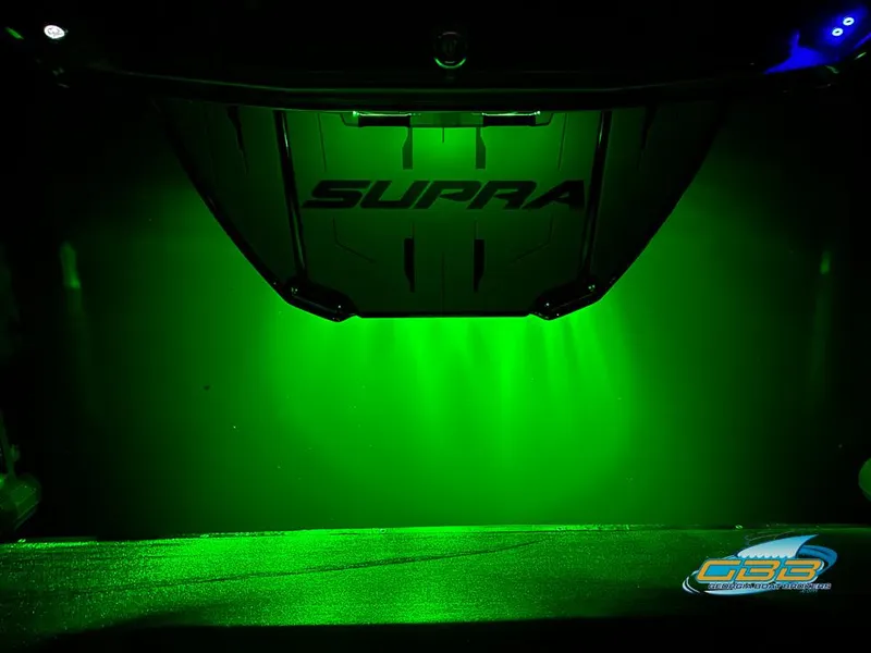 Slide: The Image of 2024 Supra SE with green underglow lighting, showcasing sleek design and modern aesthetics. - 44