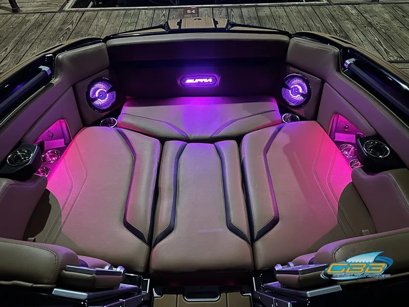 Slide: The Image of 2024 Supra SE boat interior with ambient purple lighting and premium seating. - 47