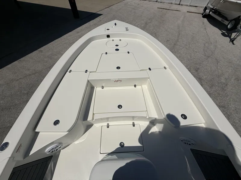Slide: The Image of 2025 Pathfinder 2600 HPS boat deck with storage compartments and sleek design. - 12