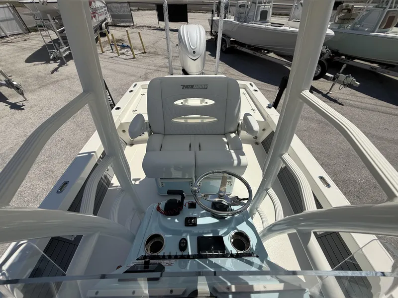 Slide: The Image of 2025 Pathfinder 2600 HPS boat interior with steering console and seating. - 16