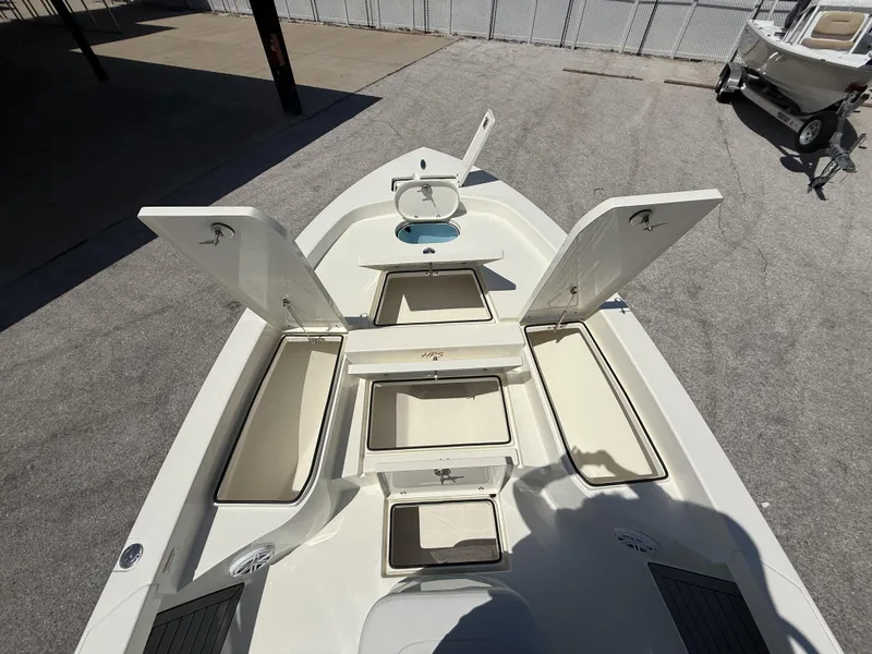 Slide: The Image of 2025 Pathfinder 2600 HPS boat with open storage compartments, showcasing spacious deck layout. - 17