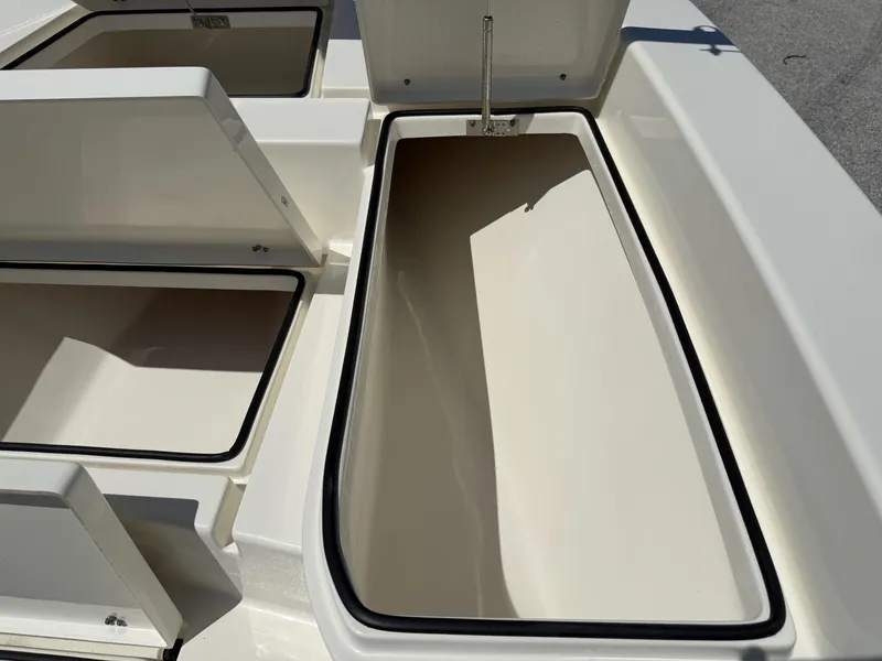 Slide: The Image of Open storage compartments on a 2025 Pathfinder 2600 HPS boat, showcasing ample space. - 18