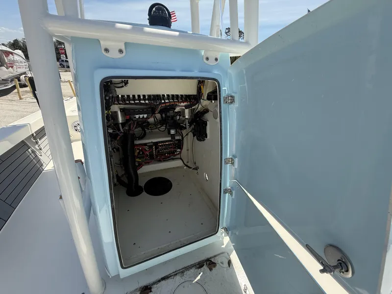 Slide: The Image of Open compartment of 2025 Pathfinder 2600 HPS boat showing internal wiring and components. - 22