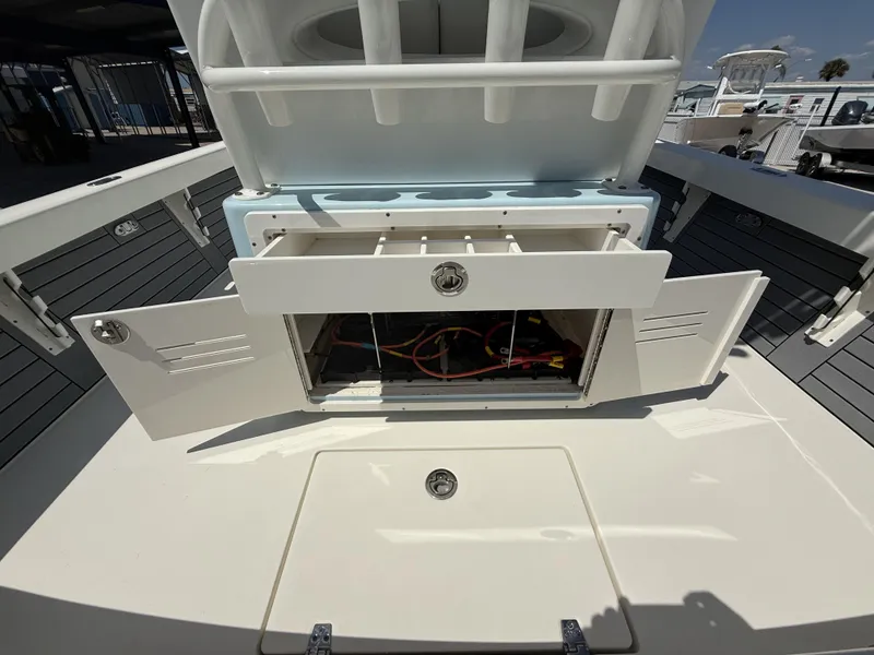 Slide: The Image of Open storage compartments on a 2025 Pathfinder 2600 HPS boat, showcasing interior features. - 24