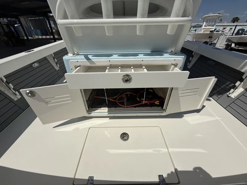 Slide: The Image of Open storage compartments on a 2025 Pathfinder 2600 HPS boat, showcasing interior details. - 25