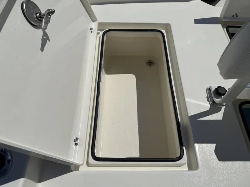 Slide: The Image of Open storage compartment on 2025 Pathfinder 2600 HPS boat deck. - 26