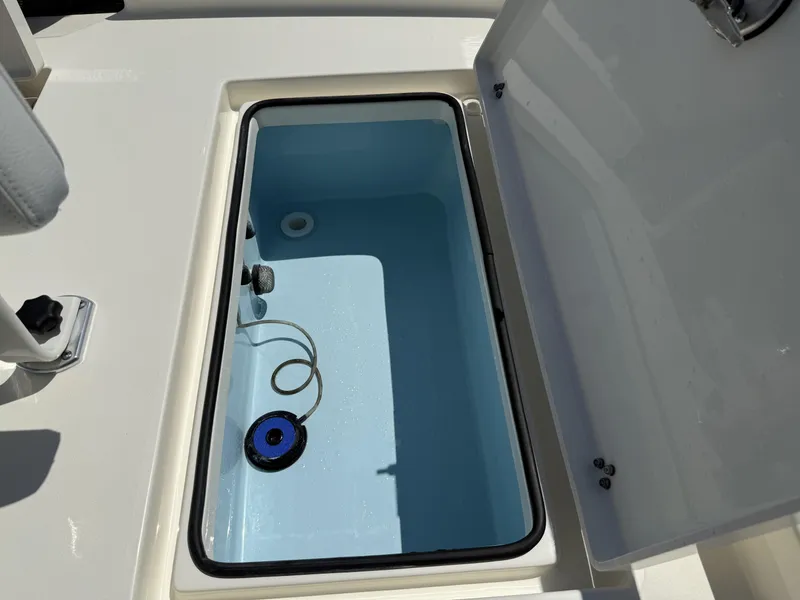 Slide: The Image of Open storage compartment on 2025 Pathfinder 2600 HPS boat, featuring a clean interior. - 28