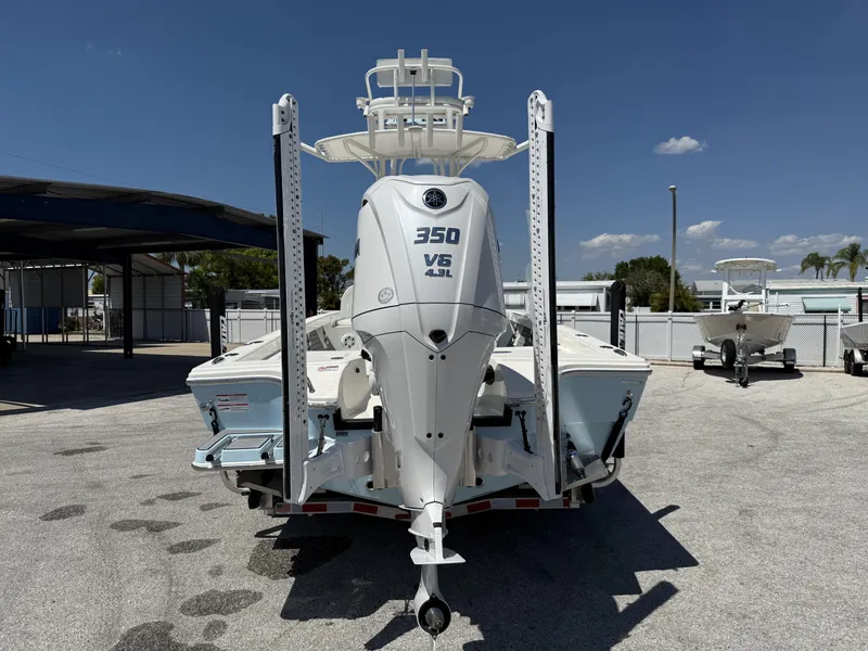 Slide: The Image of 2025 Pathfinder 2600 HPS boat with powerful 350 V6 engine, parked outdoors. - 3