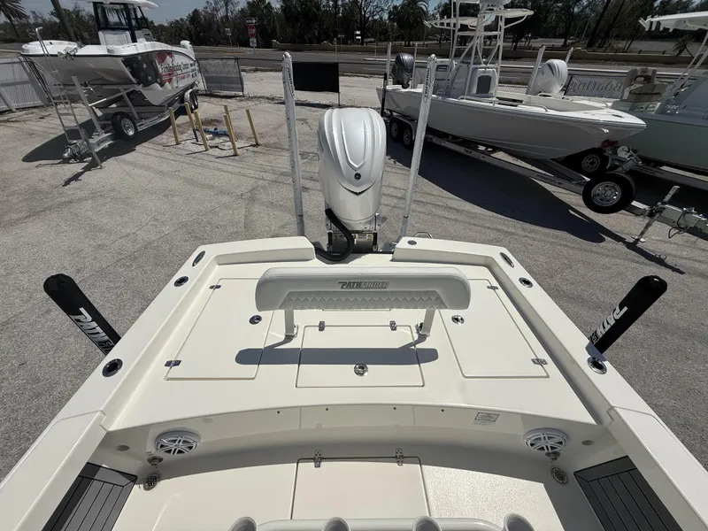 Slide: The Image of 2025 Pathfinder 2600 HPS boat, rear view, showcasing deck and motor in a marina setting. - 42