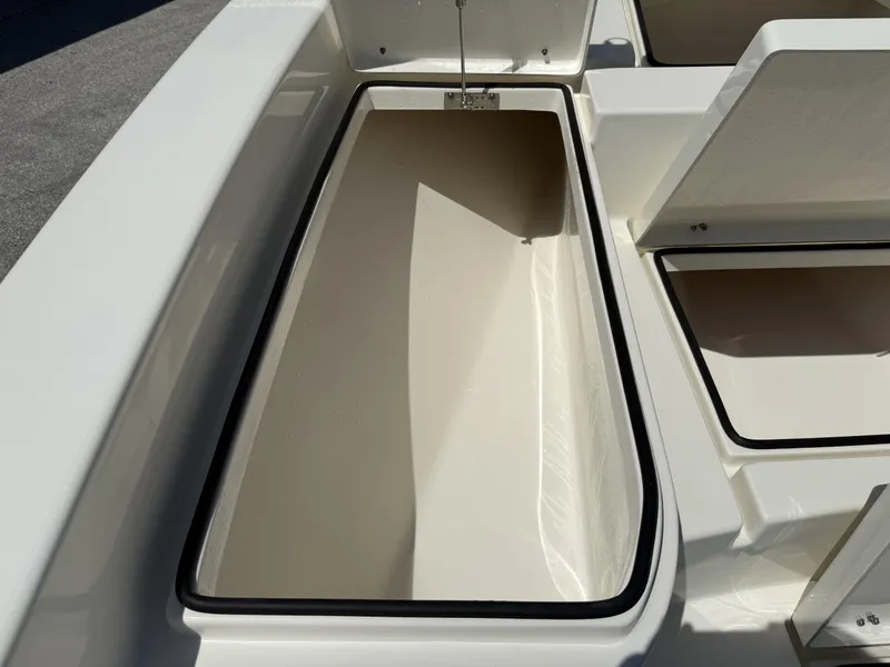 Slide: The Image of Open storage compartments on a 2025 Pathfinder 2600 HPS boat, showcasing spacious interior. - 45