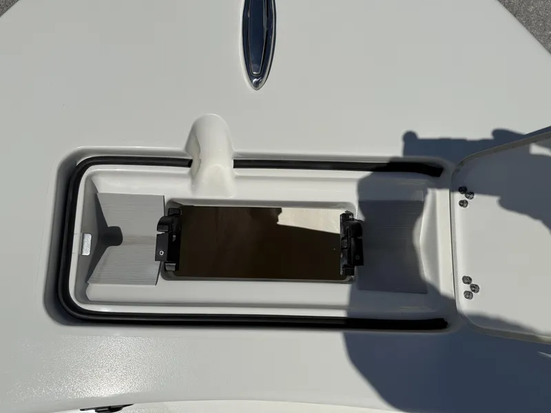 Slide: The Image of 2025 Pathfinder 2600 HPS boat storage compartment with secure latch and sleek design. - 46