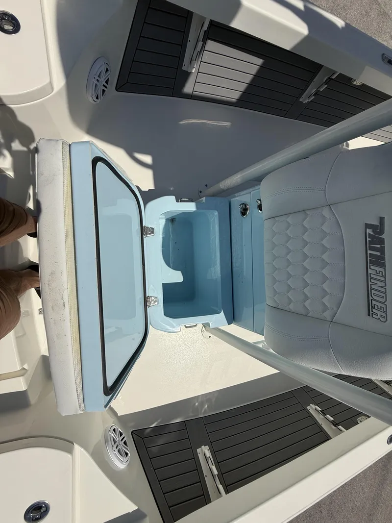 Slide: The Image of 2025 Pathfinder 2600 HPS boat interior with open storage compartment and seating. - 48