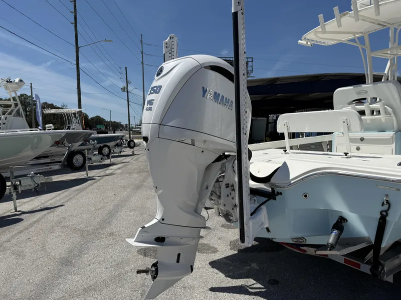 Slide: The Image of 2025 Pathfinder 2600 HPS boat with Yamaha V6 outboard motor in a sunny outdoor setting. - 5