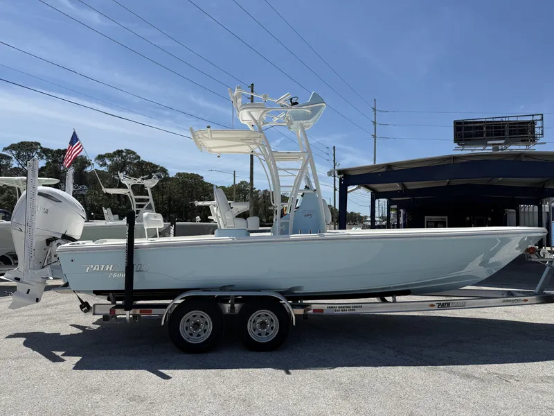 Slide: The Image of 2025 Pathfinder 2600 HPS boat on trailer, displayed outdoors under clear sky. - 6