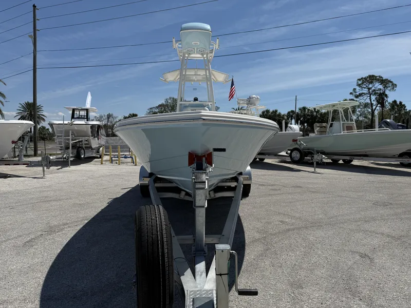 Slide: The Image of 2025 Pathfinder 2600 HPS boat on trailer in sunny outdoor showroom. - 8