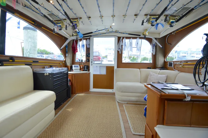 Slide: The Image of Interior of a 1998 Post 42 Convertible yacht with seating and fishing gear. - 1