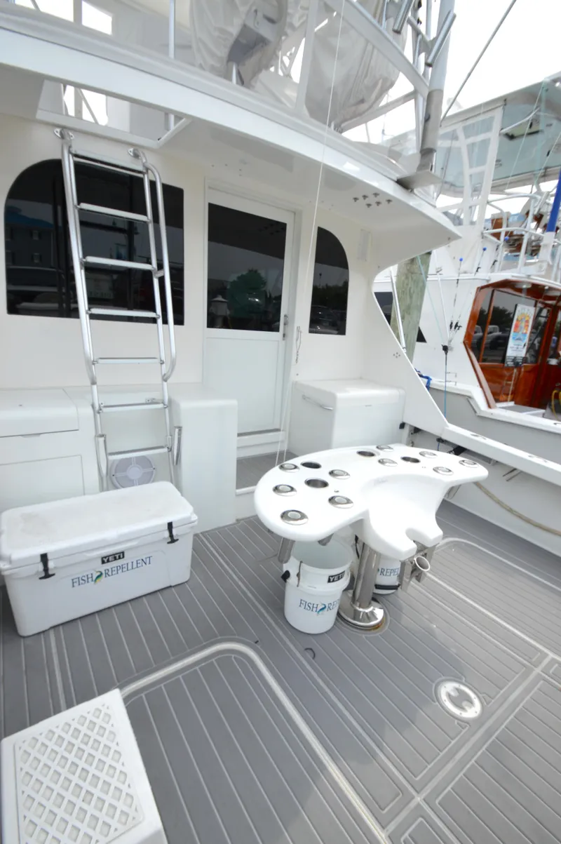 Slide: The Image of 1998 Post 42 Convertible yacht deck with fishing equipment and ladder. - 15