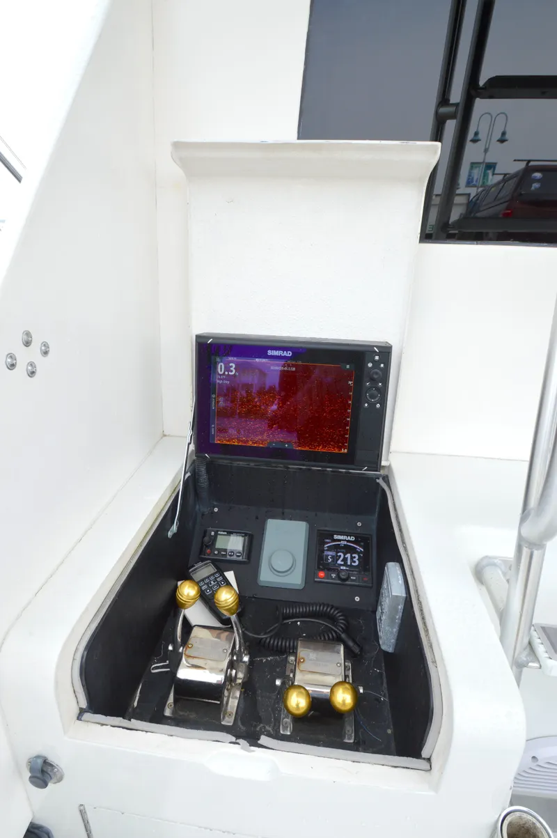Slide: The Image of Control panel of a 1998 Post 42 Convertible boat with navigation equipment. - 17