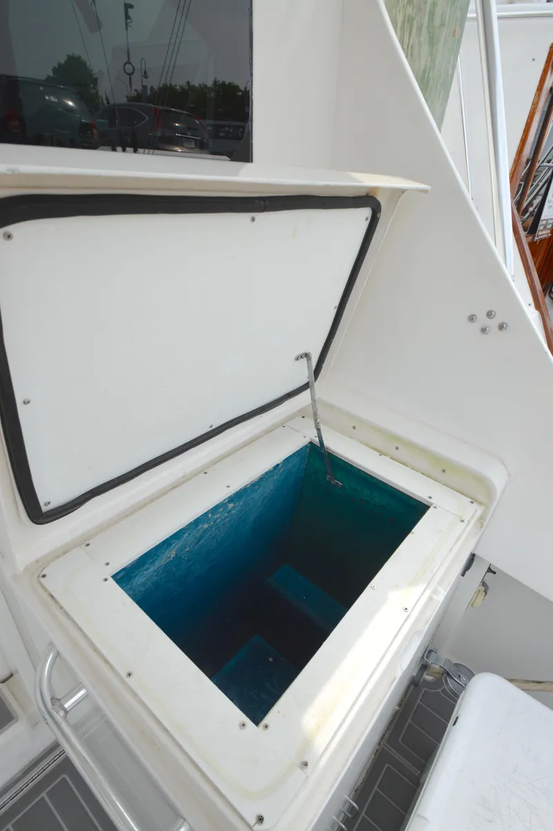 Slide: The Image of Open storage compartment on 1998 Post 42 Convertible boat deck. - 18