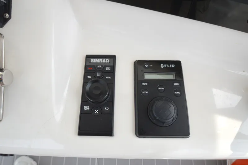 Slide: The Image of Simrad and FLIR control panels on 1998 Post 42 Convertible yacht. - 29