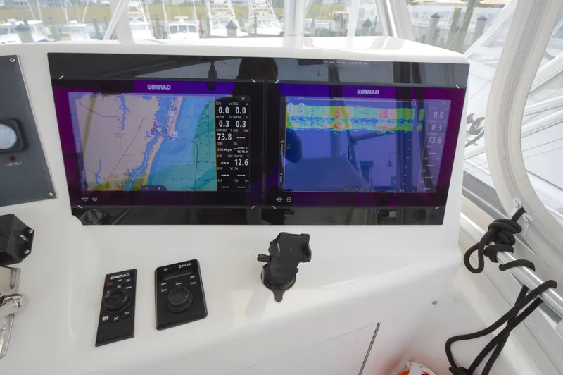 Slide: The Image of Simrad navigation system on 1998 Post 42 Convertible yacht dashboard. - 30
