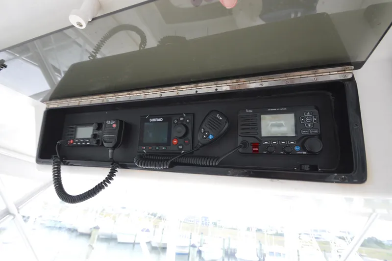 Slide: The Image of Marine electronics panel on 1998 Post 42 Convertible boat, featuring communication devices. - 32