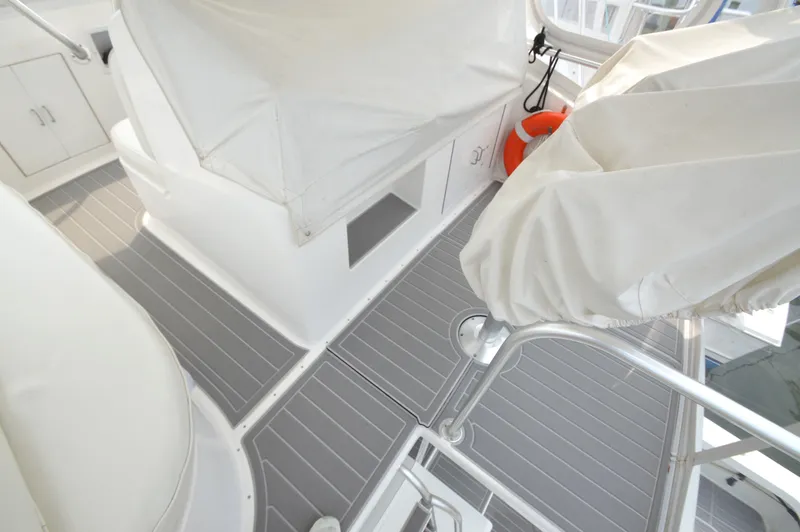 Slide: The Image of Interior of 1998 Post 42 Convertible yacht with covered seating and life preserver. - 35