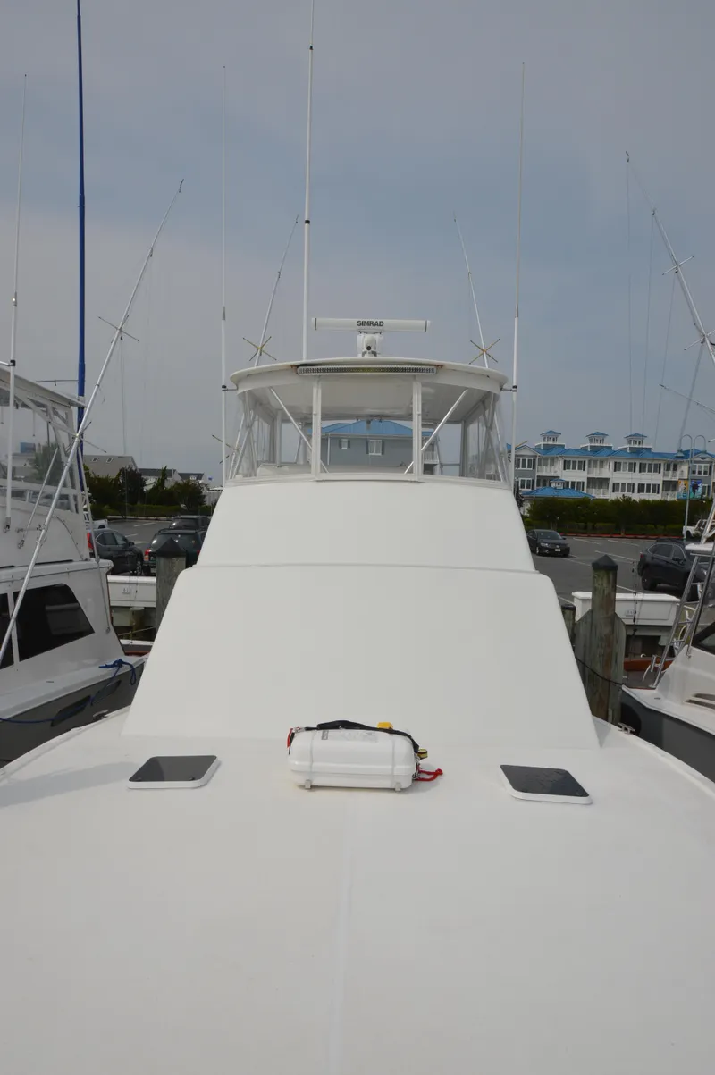 Slide: The Image of 1998 Post 42 Convertible yacht docked at marina, front view. - 41