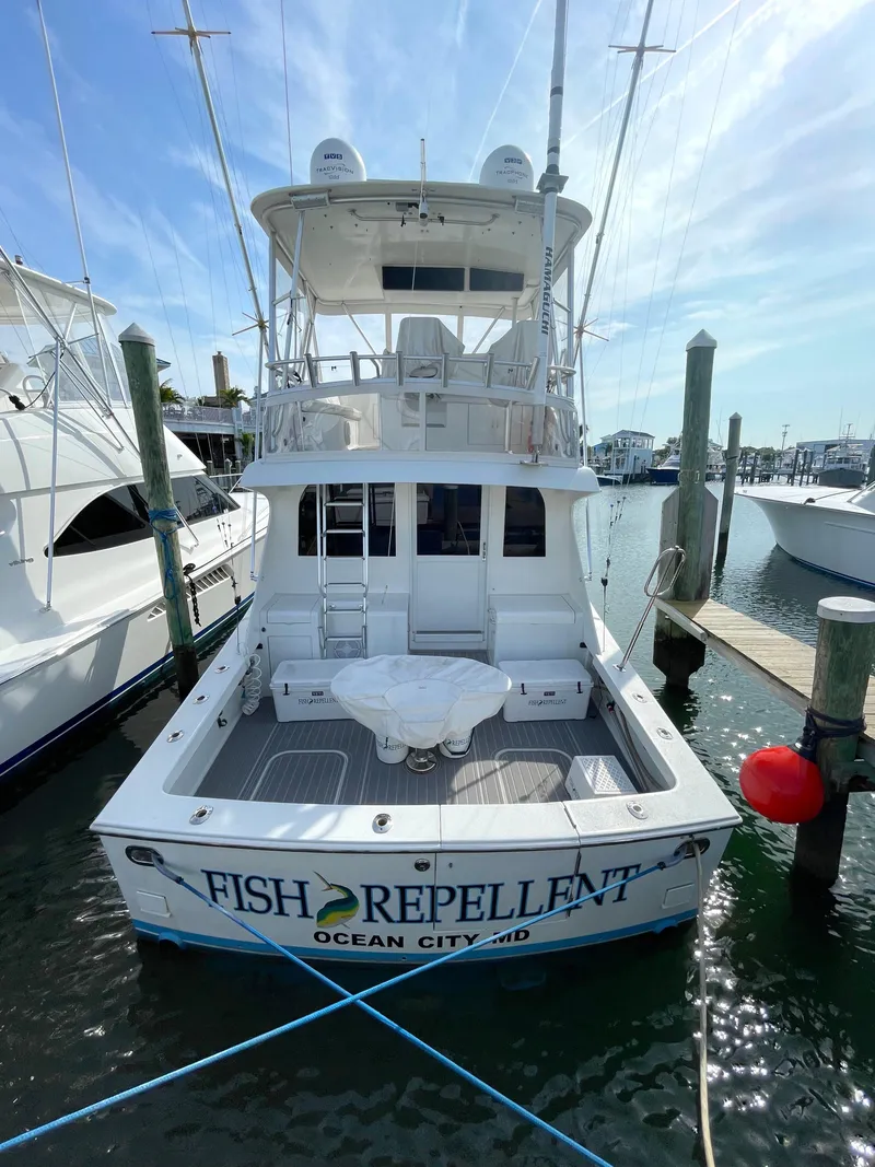 Slide: The Image of 1998 Post 42 Convertible boat docked, named "Fish Repellent," Ocean City, MD. - 6