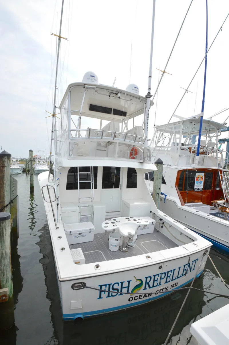 Slide: The Image of 1998 Post 42 Convertible boat docked, named "Fish Repellent," Ocean City, MD. - 9