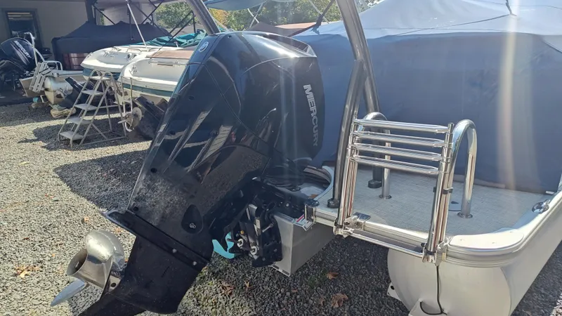 Slide: The Image of 2023 South Bay 523E 2.75 pontoon boat with Mercury outboard motor. - 13
